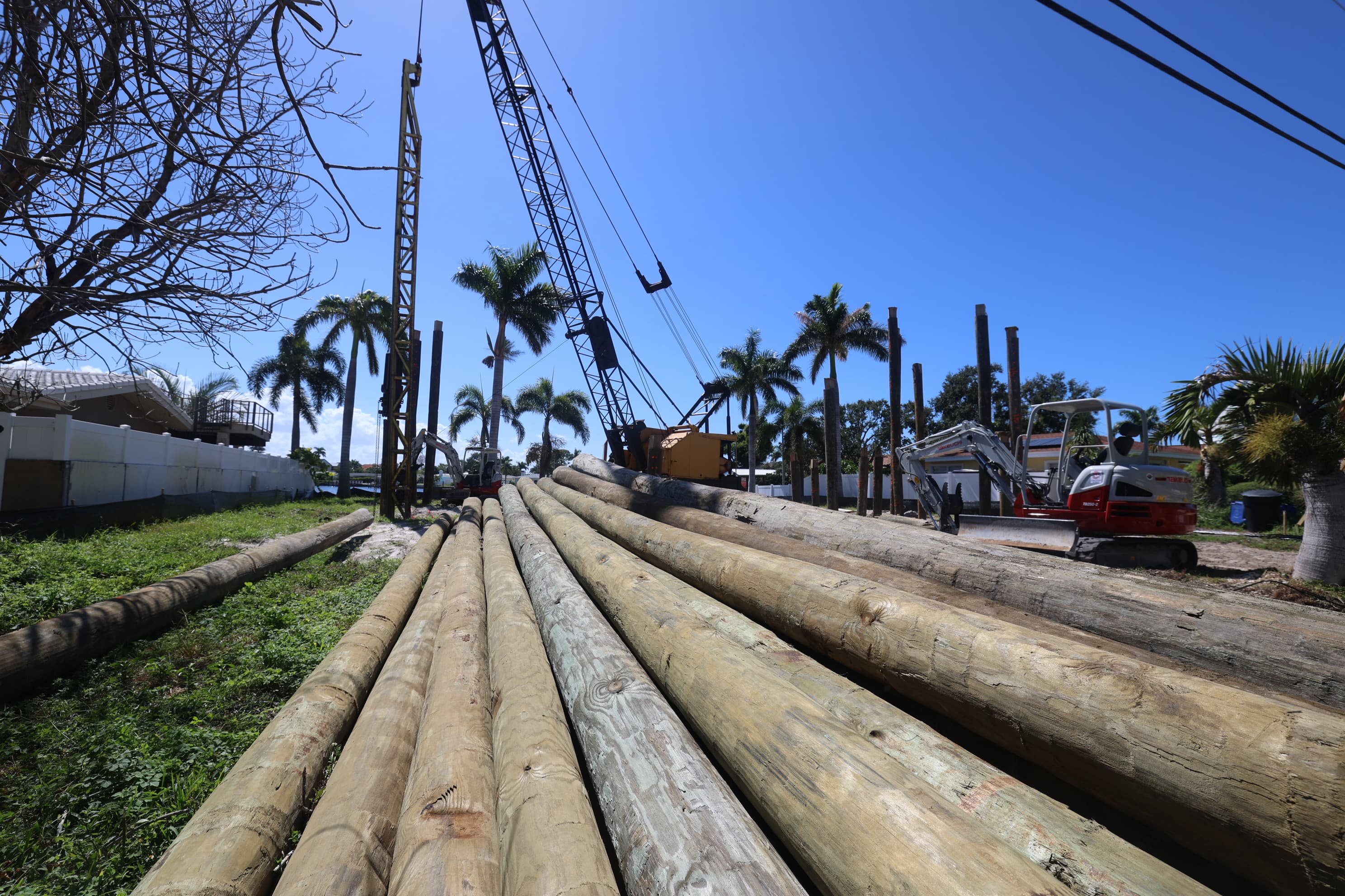 Foundation pilings being driven for a custom home on a coastal St. Petersburg lot
