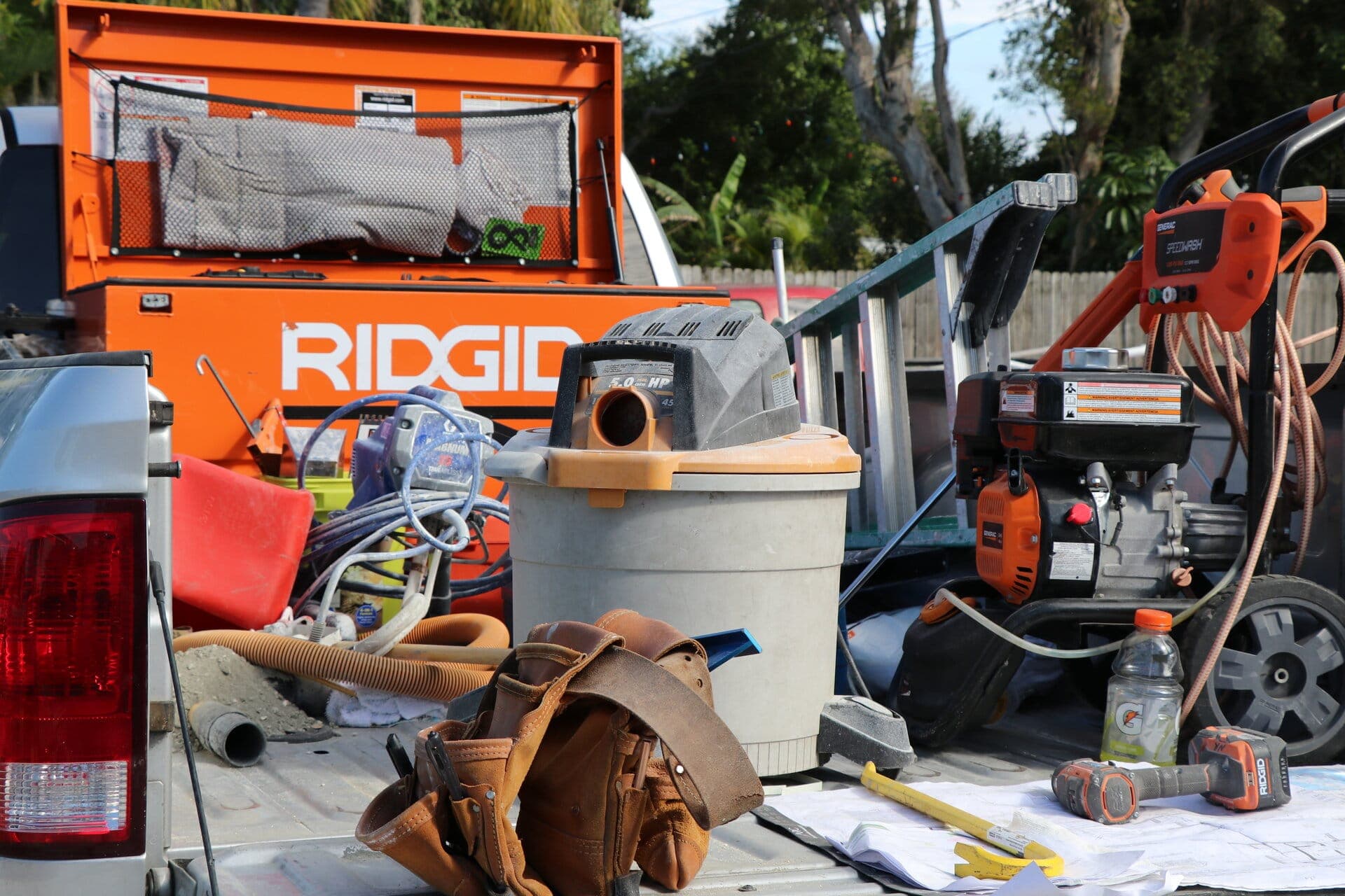 Revolution Contractors work truck loaded with Ridgid tools on a St. Petersburg jobsite